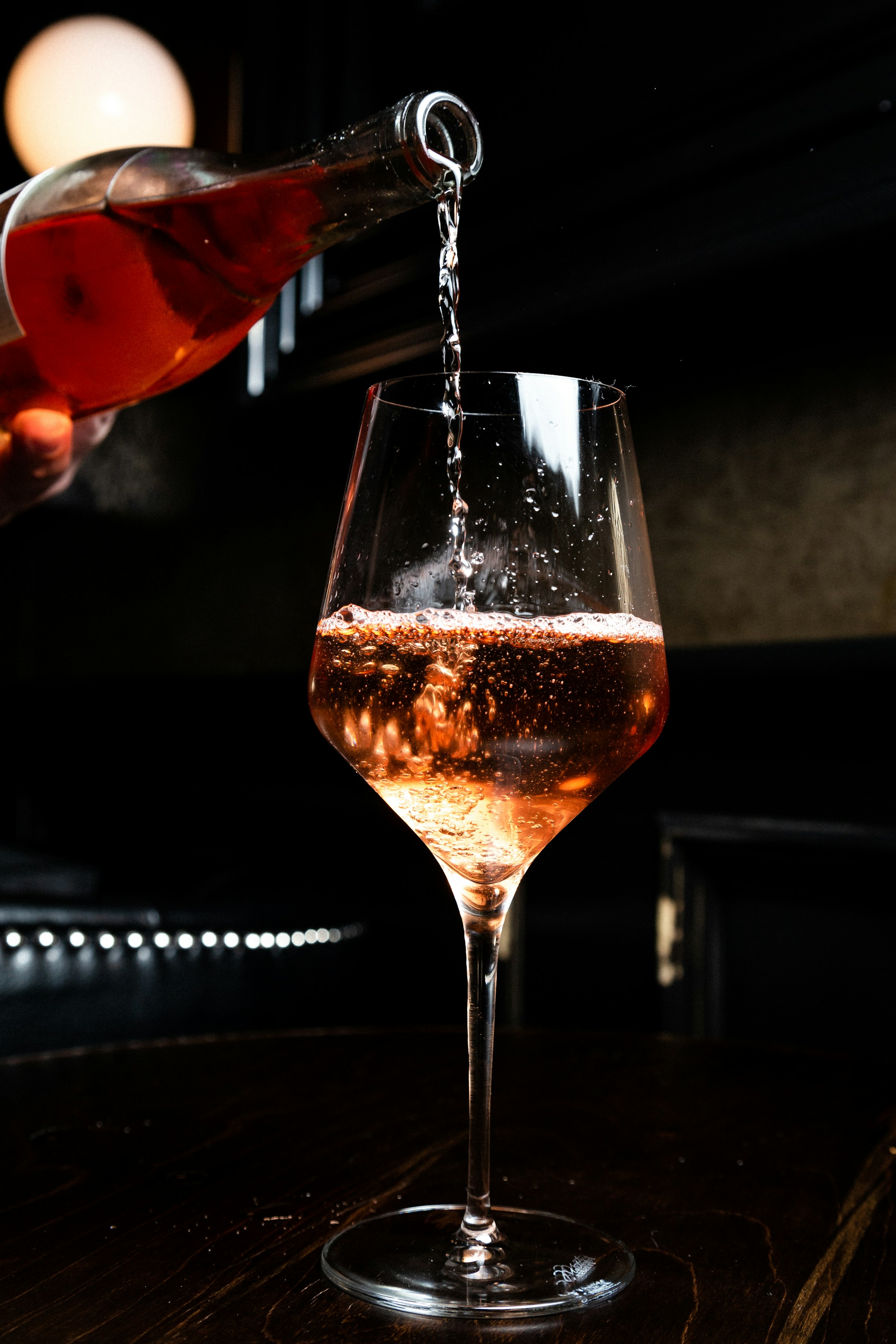 Sparkling wine being poured into a glass for a celebration